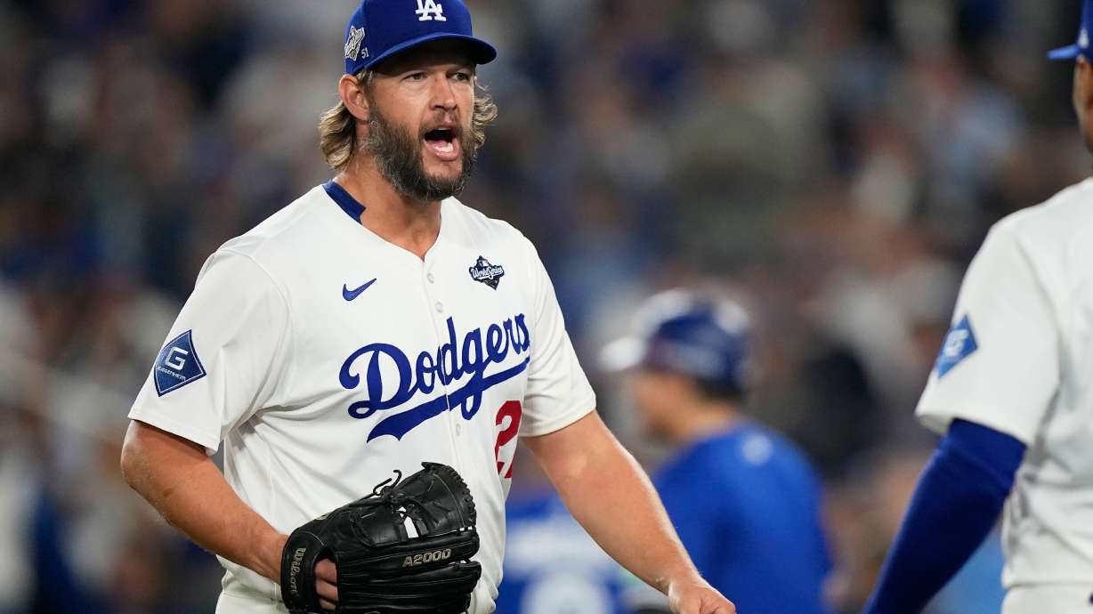FILE - Los Angeles Dodgers pitcher Clayton Kershaw celebrates the end of the top of the 12th inning against the Toronto Blue Jays in Game 3 of baseball's World Series, Monday, Oct. 27, 2025, in Los Angeles.