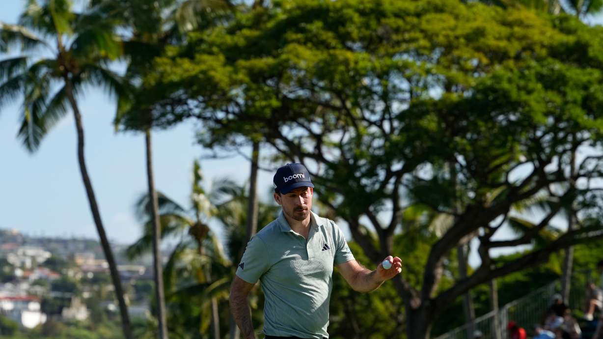 Nick Taylor, of Canada, reacts on the 18tyh hole during the first round of the Sony Open golf event at the Waialae Country Club in Honolulu, Thursday, Jan. 15, 2026.
