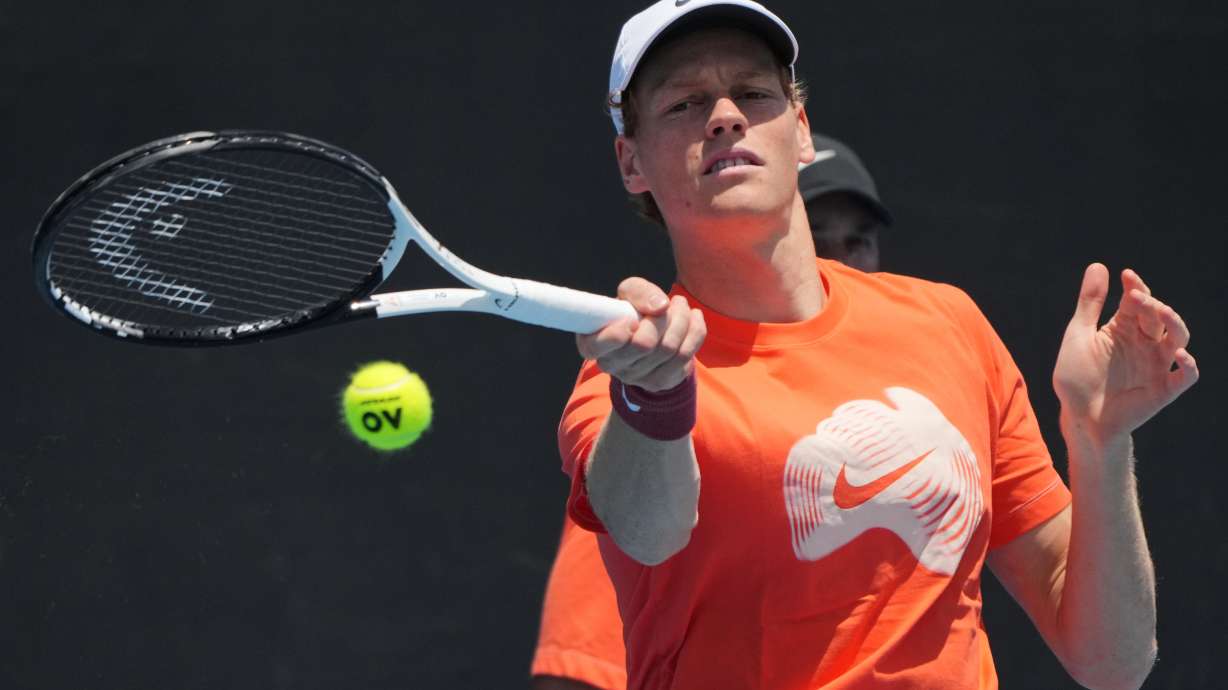 Jannik Sinner of Italy plays a forehand return to during a practice session ahead of the Australian Open tennis championship in Melbourne, Australia, Friday, Jan. 16, 2026.