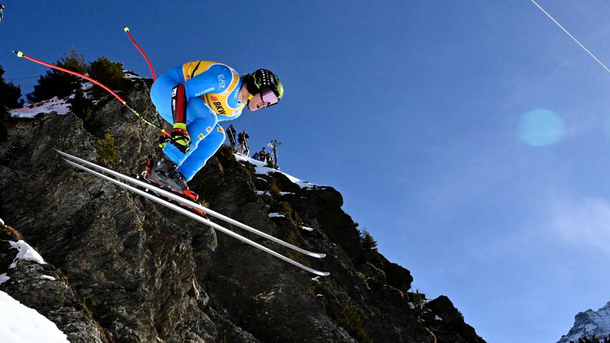 Giovanni Franzoni of Italy takes a jump during the alpine ski, men's World Cup super-G race, in Wengen, Switzerland, Friday, Jan. 16, 2026.