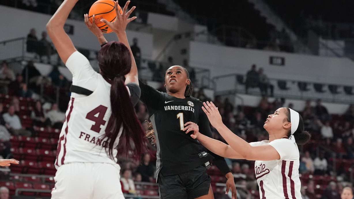 Vanderbilt guard Mikayla Blakes (1) is pressured by Mississippi State forward Madison Francis, left, and guard Saniyah King (1) as she attempts a layup during the first half of an NCAA college basketball game, Thursday, Jan. 15, 2026, in Starkville, Miss.