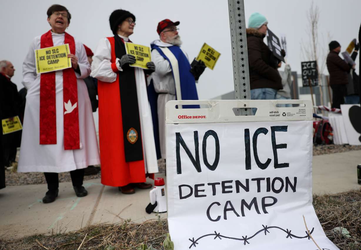 Around 100 people protested Immigration and Customs Enforcement outside a potential future ICE detention center site in Salt Lake City on Friday.