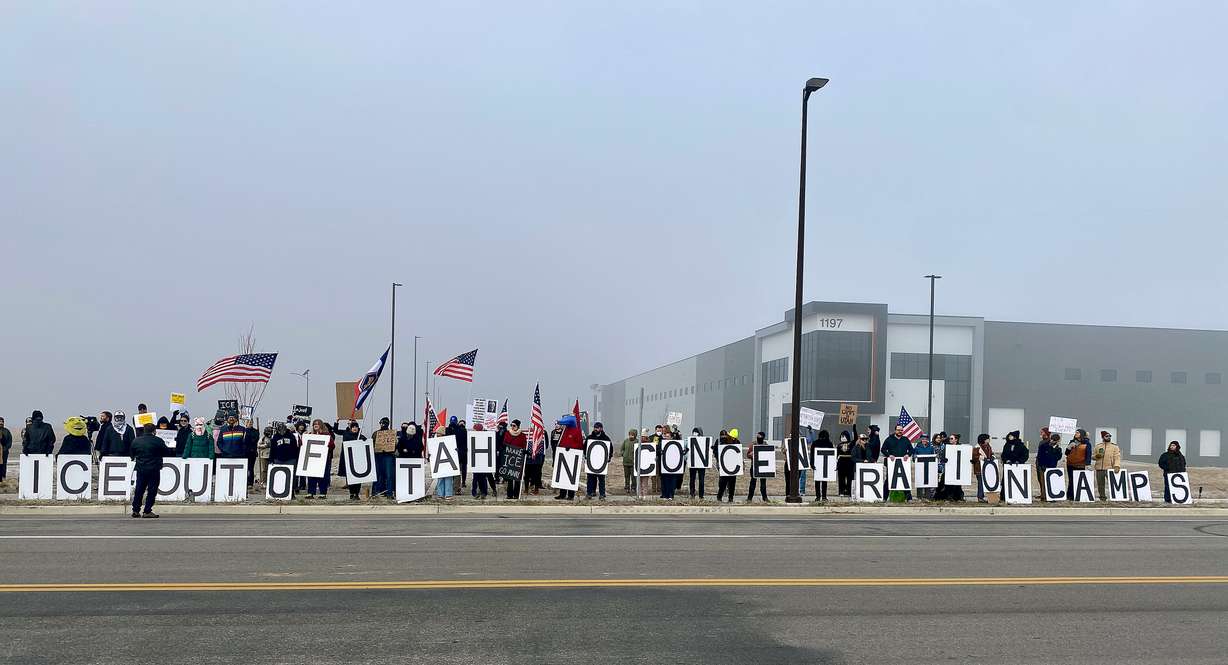 Around 100 people protested Immigration and Customs Enforcement outside a potential future ICE detention center site in Salt Lake City on Friday.