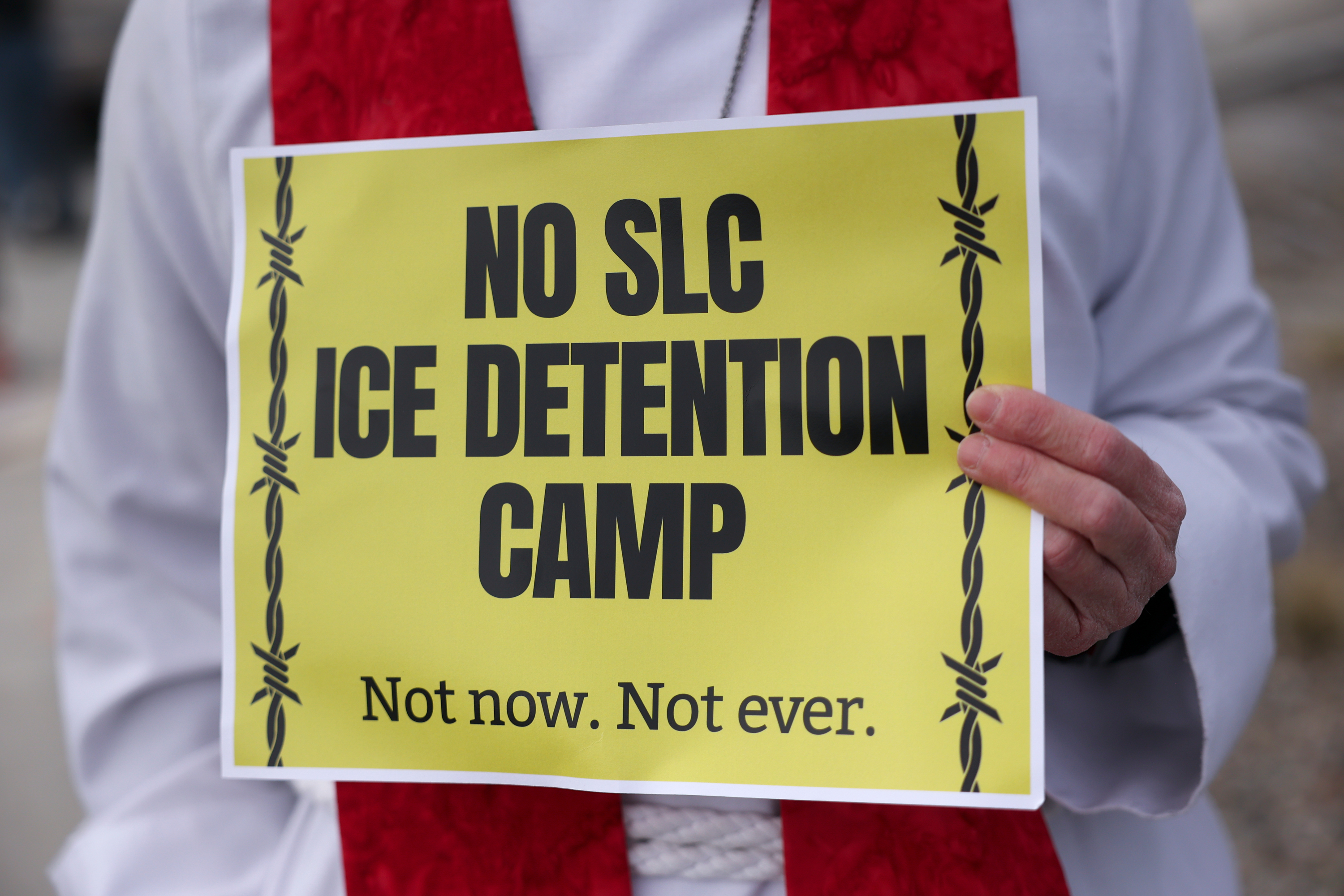 Faith leaders joined around 100 protesters outside a potential future Immigration and Customs Enforcement immigrant detention center in Salt Lake City on Friday.