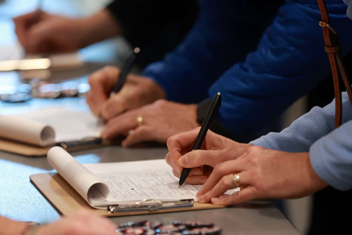 People sign to repeal Proposition 4 at the Weber County Fights Back Rally with Scott Presler at the Roy Library in Roy on Friday, Jan. 16, 2026.