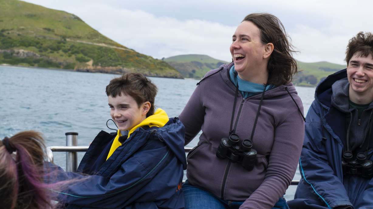 Andrew Jeffs, 12, of Draper, with his mother and brother, during a trip granted by Make-A-Wish to New Zealand in November 2025 to see native penguins.