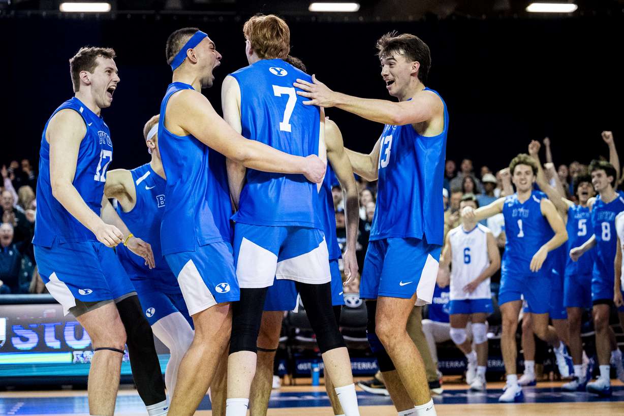 BYU players celebrate around middle blocker AJ Cottle (7) after a point against UC San Diego during an NCAA men’s volleyball game held at the George Albert Smith Fieldhouse in Provo on Friday, Jan. 16, 2026.