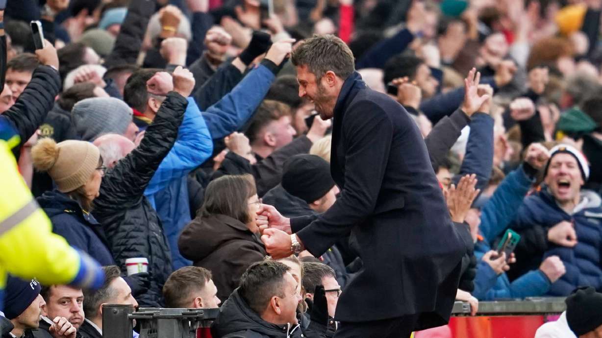 Manchester United's head coach Michael Carrick celebrates during the English Premier League soccer match between Manchester United and Manchester City in Manchester, England, Saturday, Jan. 17, 2026.