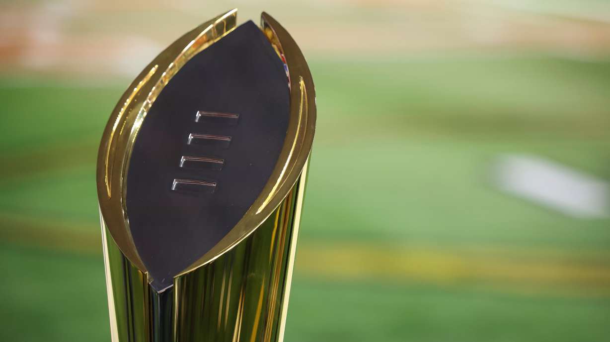 FILE - The College Football Playoff National Championship Trophy is shown before the Cotton Bowl College Football Playoff semifinal game between Texas and Ohio State, Friday, Jan. 10, 2025, in Arlington, Texas.