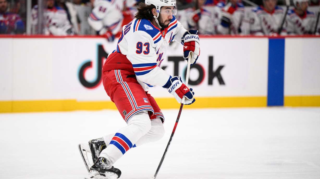 New York Rangers center Mika Zibanejad (93) skates with the puck during the first period of an NHL hockey game against the Washington Capitals, Tuesday, Dec. 23, 2025, in Washington.