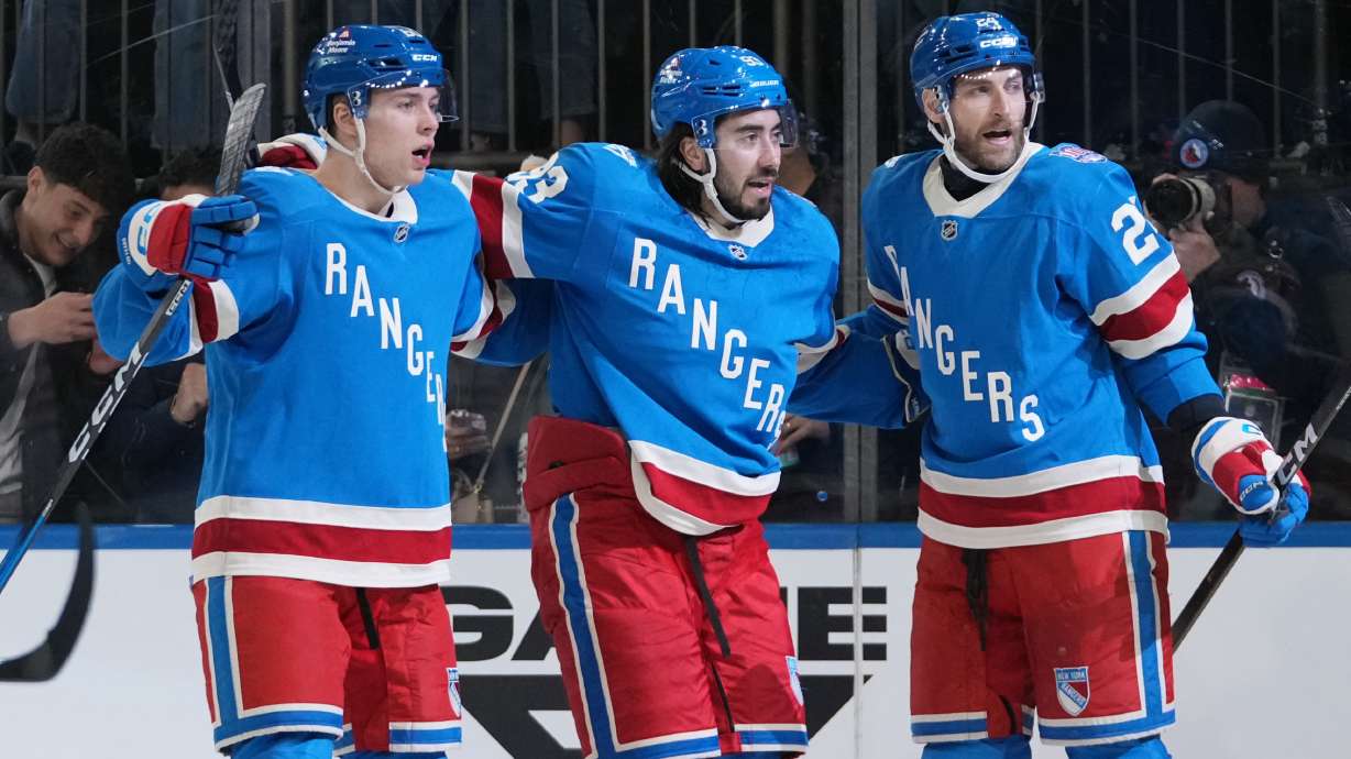 New York Rangers' Mika Zibanejad, center, celebrates with teammates Carson Soucy, right, and Scott Morrow after scoring a goal during the second period of an NHL hockey game against the Buffalo Sabres Thursday, Jan. 8, 2026, in New York.