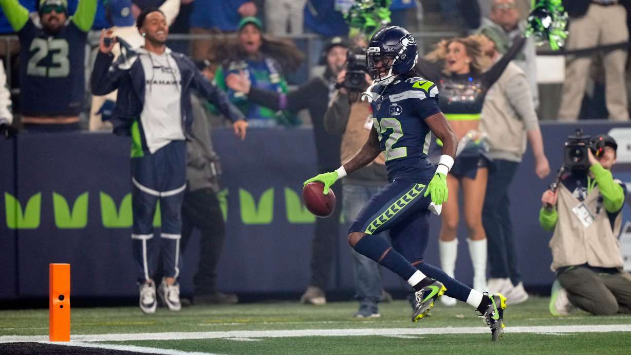 Seattle Seahawks wide receiver Rashid Shaheed (22) runs a kickoff return in for a touchdown during the first half of an NFL football divisional playoff game against the San Francisco 49ers, Saturday, Jan. 17, 2026, in Seattle.