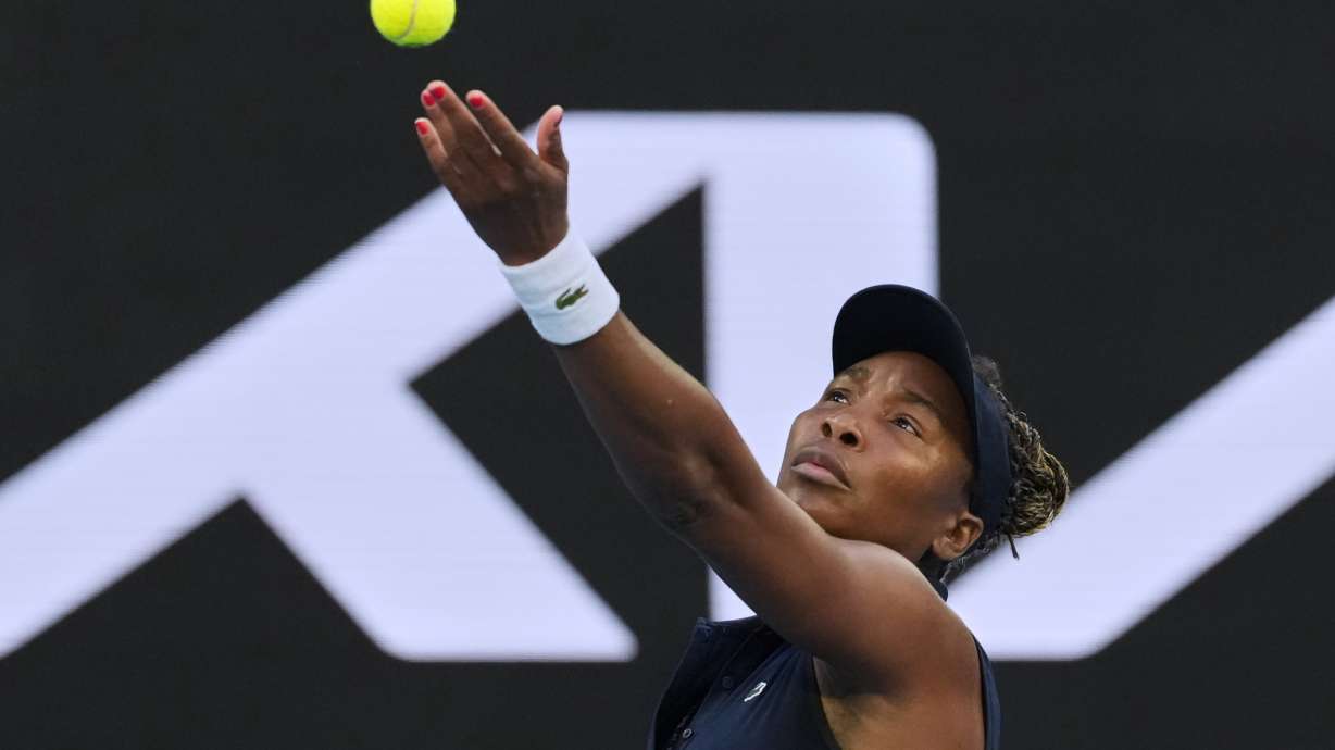 Venus Williams of the U.S. serves to Olga Danilovic of Serbia during their first round match at the Australian Open tennis championship in Melbourne, Australia, Sunday, Jan. 18, 2026.