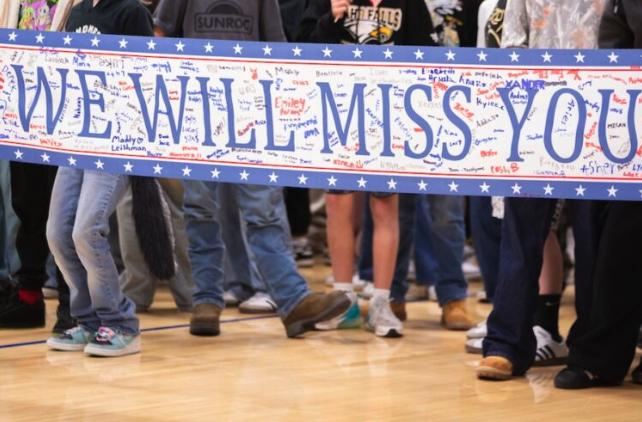 Students hold up a banner at Eagle Rock Middle School.