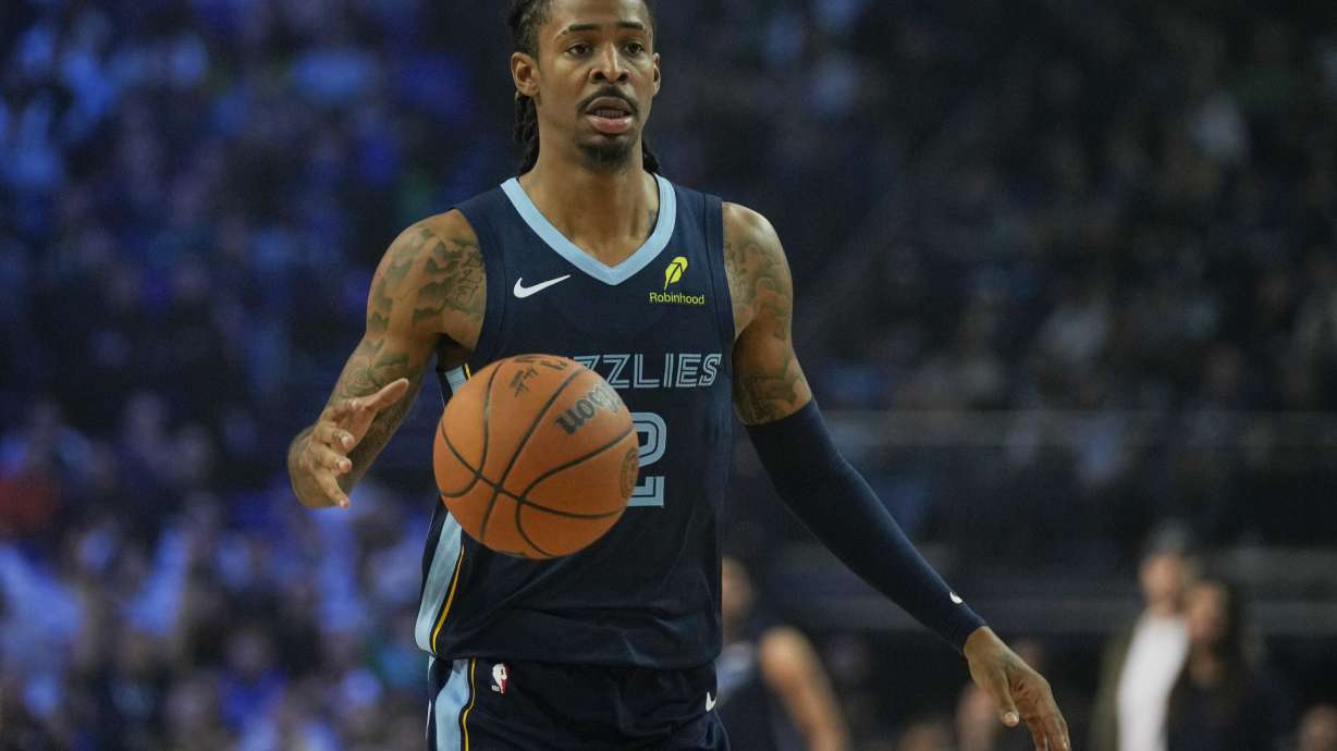 Memphis Grizzlies guard Ja Morant moves the ball during the second half of an NBA basketball game against the Orlando Magic Sunday, Jan. 18, 2026, in London.