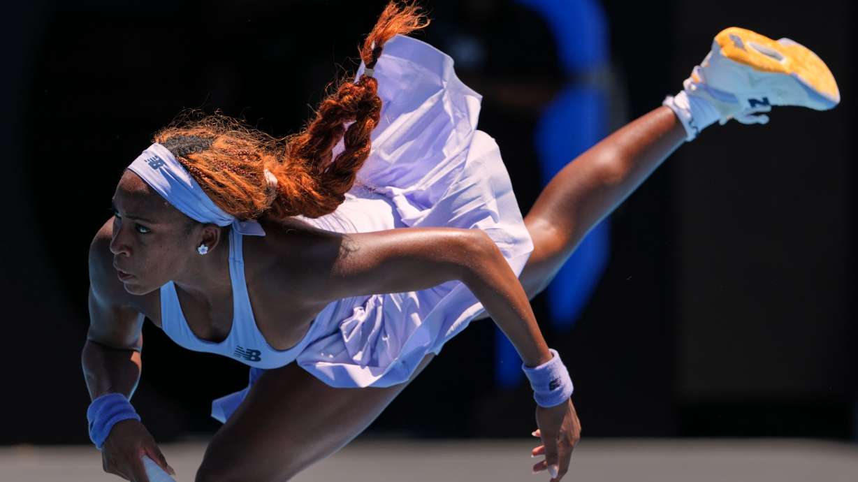 Coco Gauff of the U.S. serves to Kamilla Rakhimova of Uzbekistan during their first round match at the Australian Open tennis championship in Melbourne, Australia, Monday, Jan. 19, 2026.