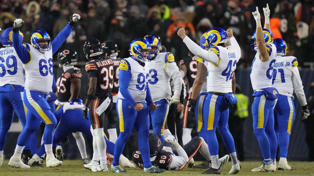 Los Angeles Rams kicker Harrison Mevis, center, reacts with holder Ethan Evans, center right, and teammates after booting a game-winning field goal during overtime of an NFL football divisional playoff game Sunday, Jan. 18, 2026, in Chicago.