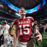 Indiana completes undefeated season and wins first national title, beating Miami 27-21 in CFP final