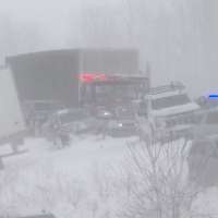 100 vehicles pile up in Michigan crash as snowstorm moves across the country