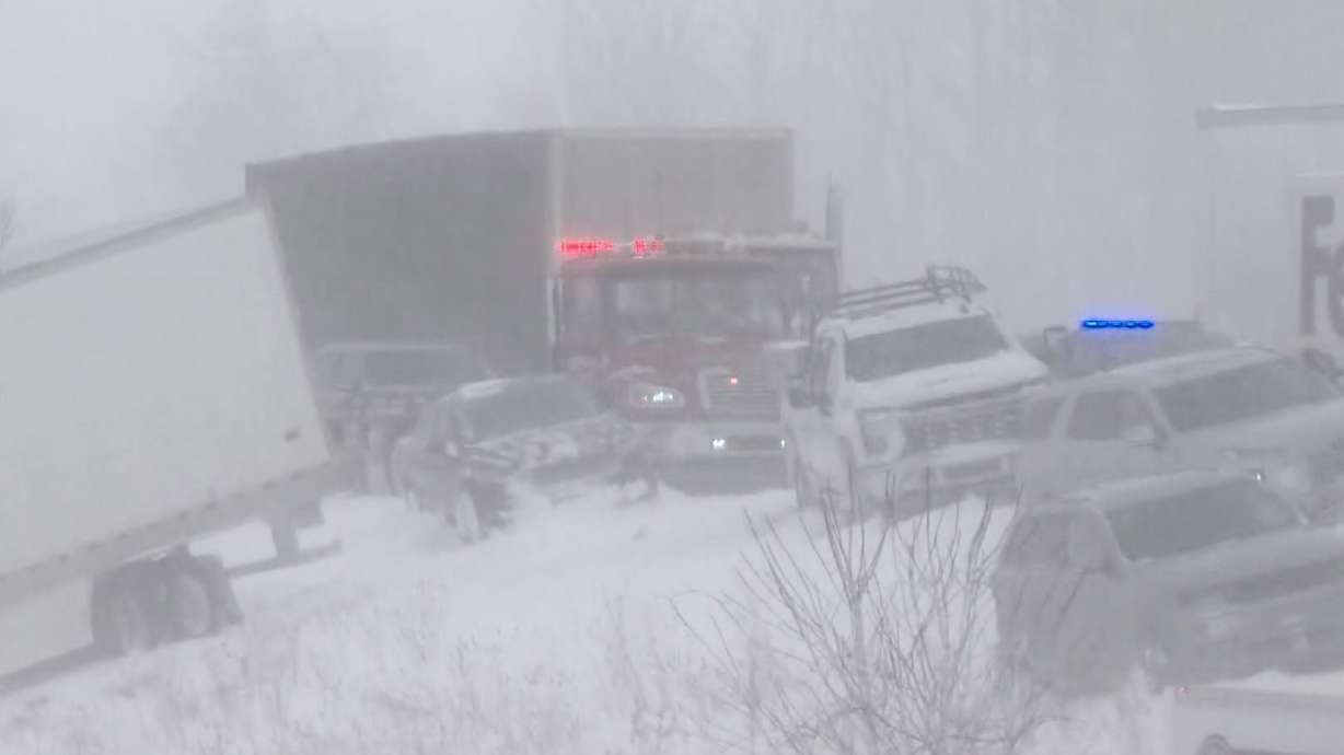 This image taken from video provided by WZZM shows part of a severe multi-car pileup leading Michigan State Police to shut down an interstate south of Grand Rapids, Monday, in Ottawa County, Mich.