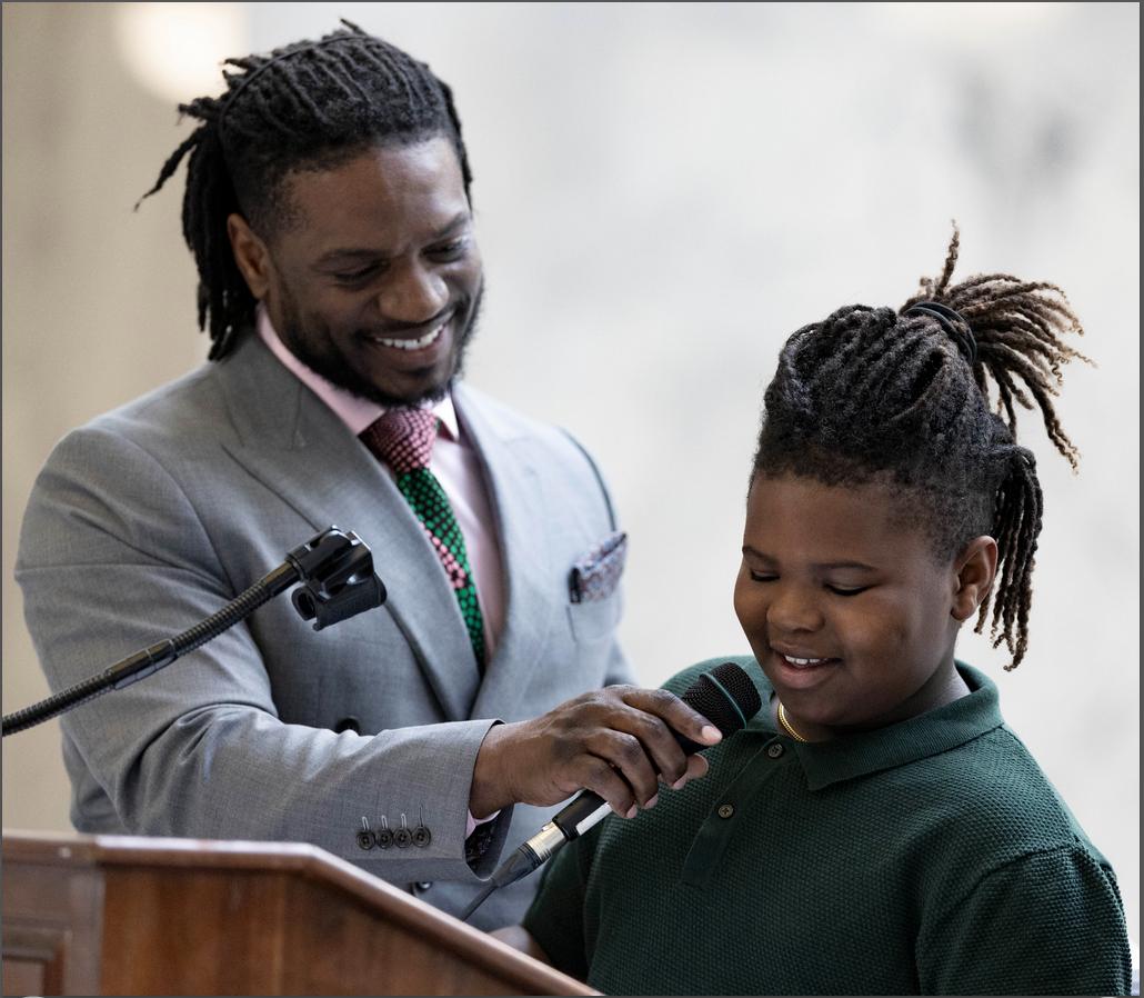 Yahosh Bonner, of American Fork, smiles as his son Nehemiah, 9, helps him recite Martin Luther King Jr.’s “I have a Dream” speech during a Martin Luther King Jr. Day Celebration hosted by Beloved Community at the Capitol in Salt Lake City on Monday.