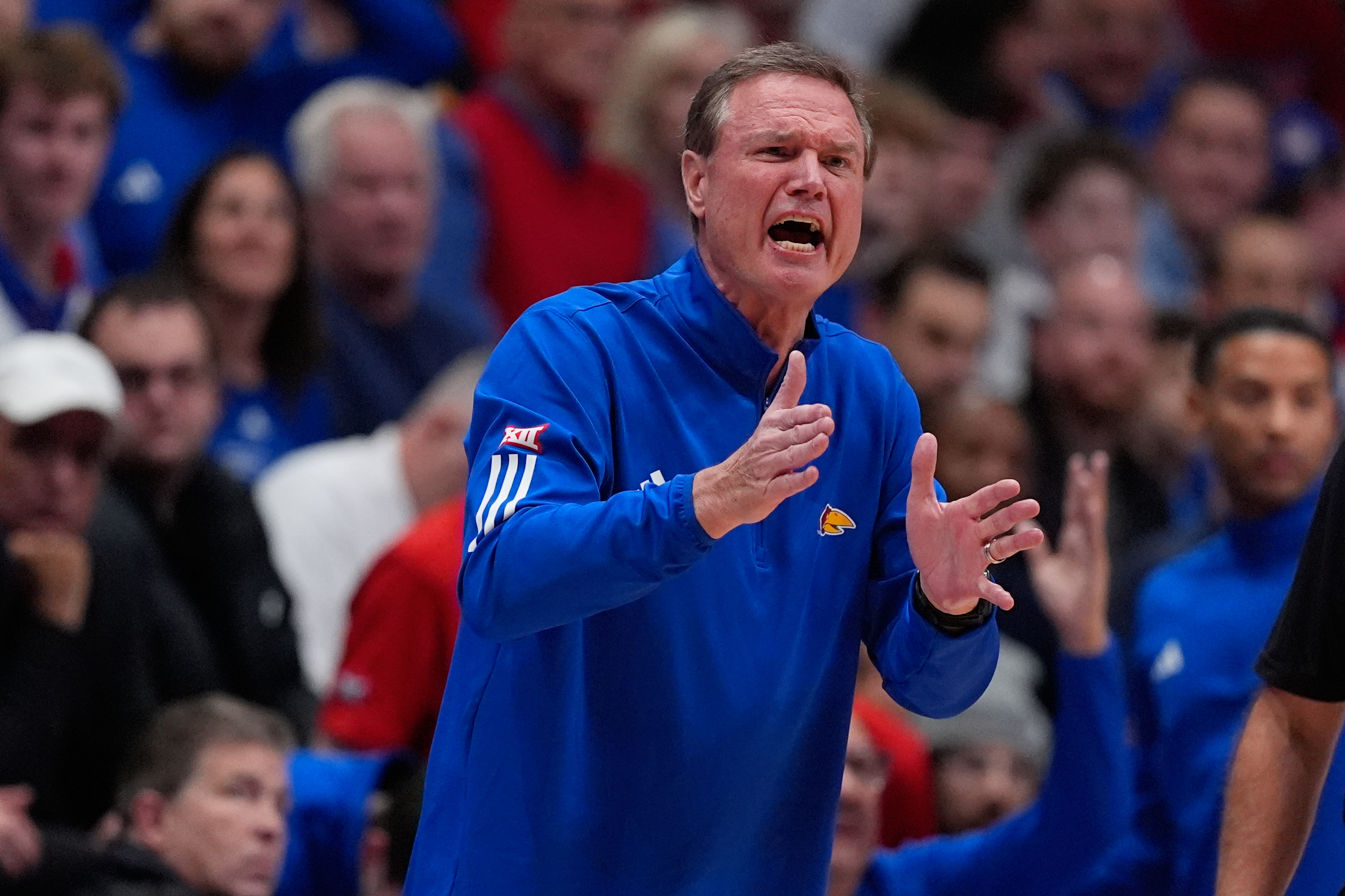 Coach Bill Self doesn't travel with No. 19 Kansas after going to the hospital, school says