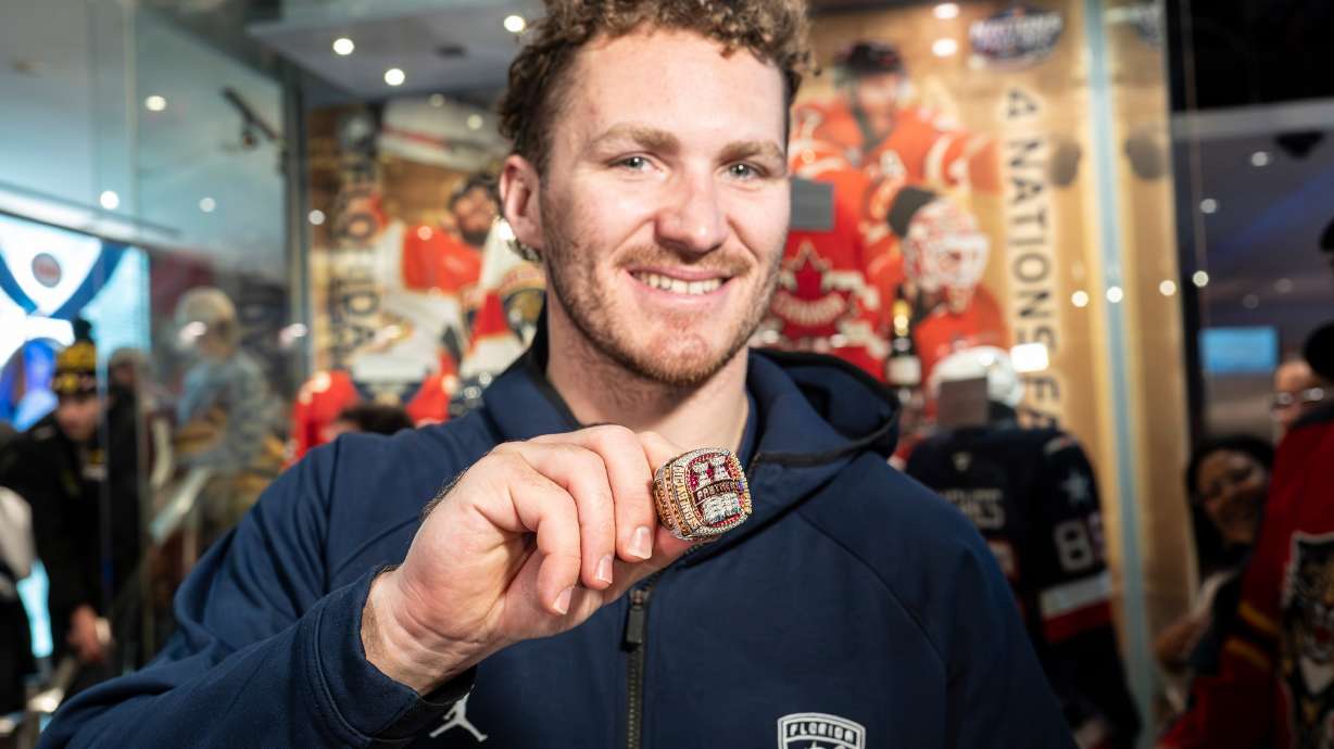 Florida Panthers' Matthew Tkachuk shows fans the team's 2025 Stanley Cup ring before placing it inside the display at the Hockey Hall of Fame in Toronto, Canada, on Tuesday, Jan. 6, 2025.