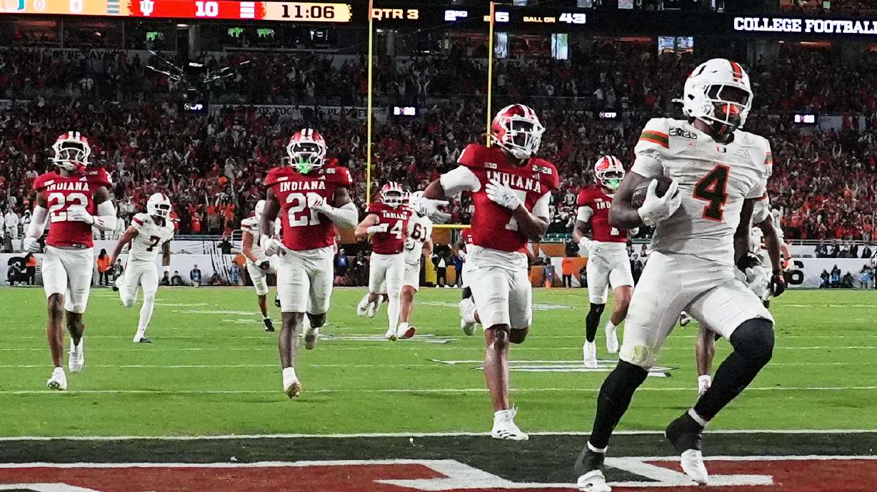 Miami running back Mark Fletcher Jr. scores against Indiana during the second half of the College Football Playoff national championship game, Monday, Jan. 19, 2026, in Miami Gardens, Fla.