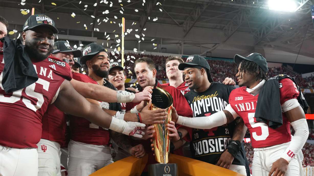 Indiana head coach Curt Cignetti holds the trophy after their win against Miami in the College Football Playoff national championship game, Monday, Jan. 19, 2026, in Miami Gardens, Fla.