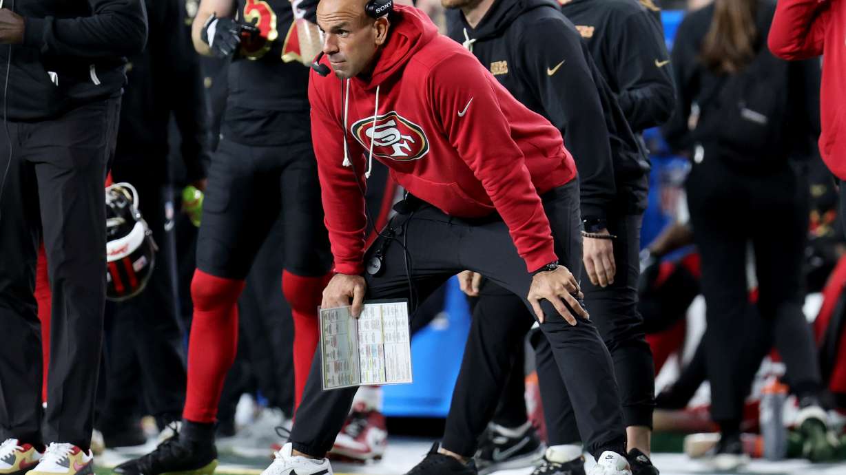 FILE - San Francisco 49ers defensive coordinator Robert Saleh stands on the sideline during an NFL football game against the Seattle Seahawks, Jan. 3, 2026, in Santa Clara, Calif.