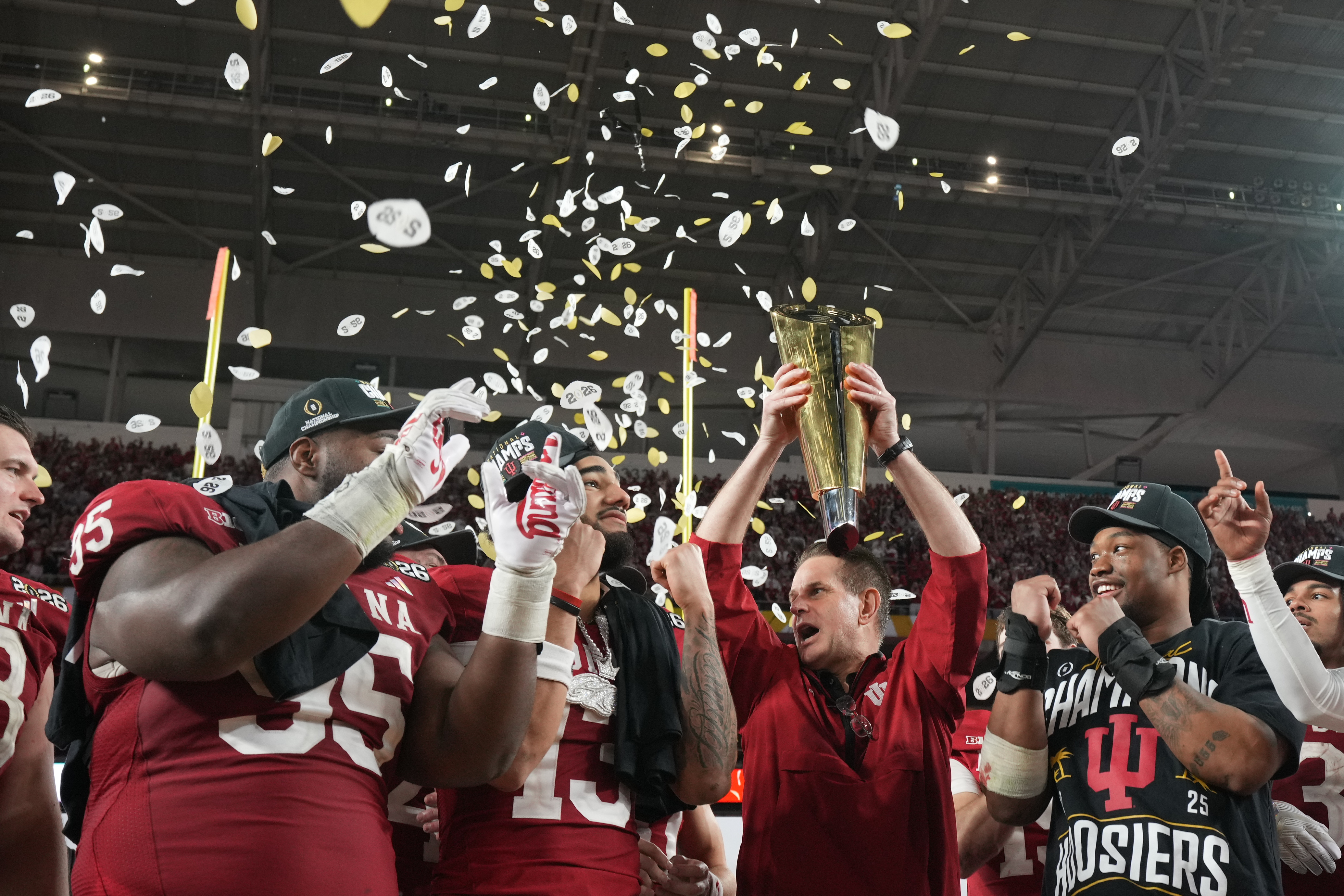Indiana head coach Curt Cignetti holds the trophy after their win against Miami in the College Football Playoff national championship game, Monday, Jan. 19, 2026, in Miami Gardens, Fla. 