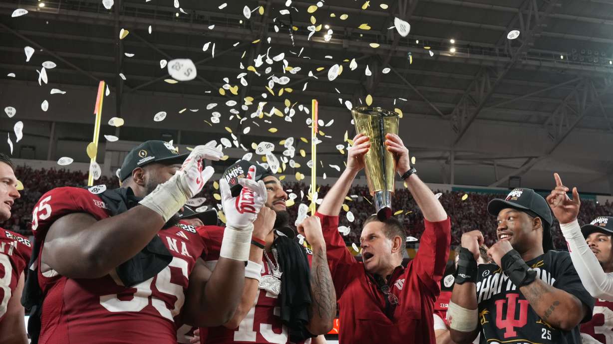 Indiana head coach Curt Cignetti holds the trophy after their win against Miami in the College Football Playoff national championship game, Monday, Jan. 19, 2026, in Miami Gardens, Fla.