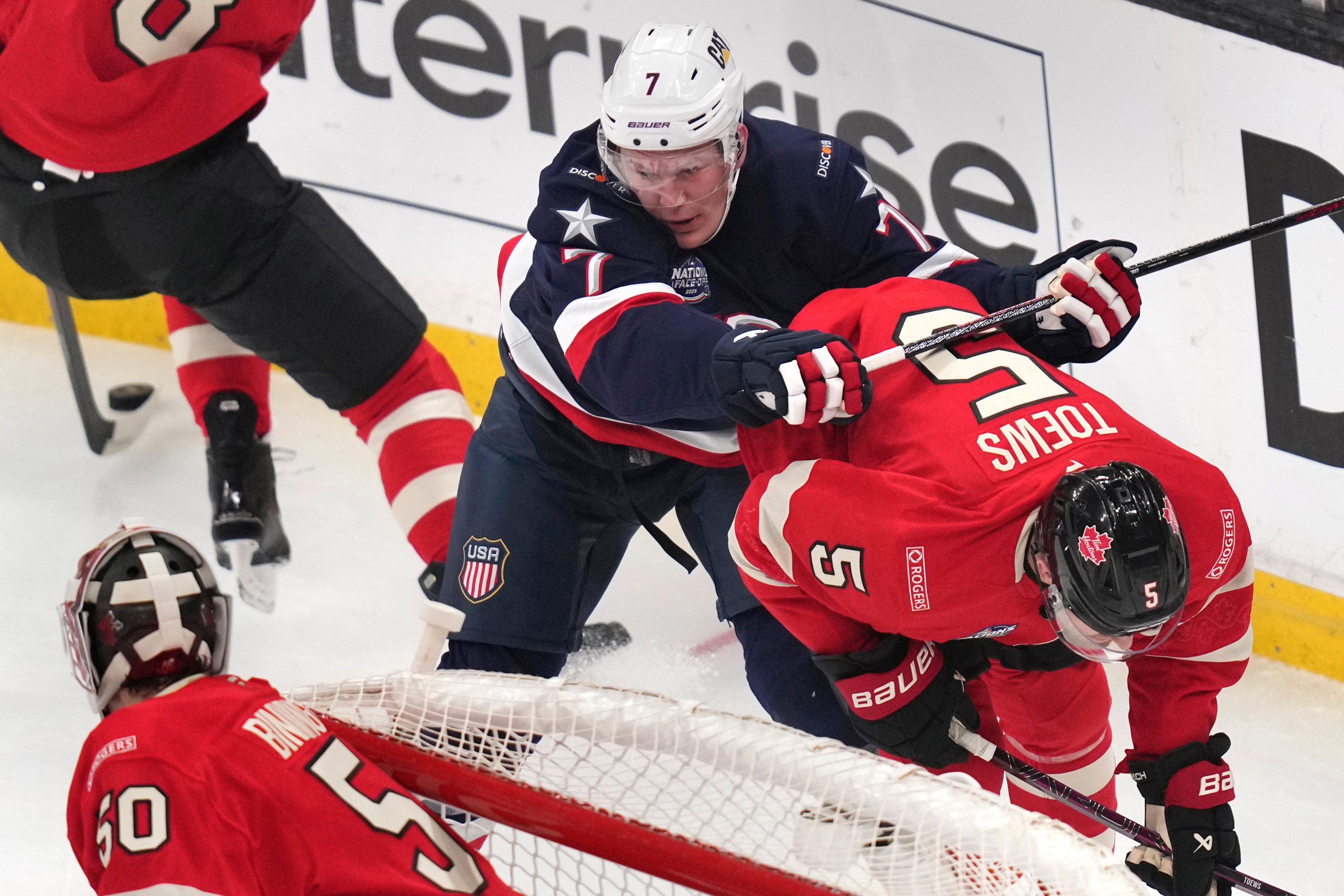 FILE - United States' Brady Tkachuk checks Canada's Devon Toews (5) during the first period of the 4 Nations Face-Off championship hockey game, Feb. 20, 2025, in Boston. 