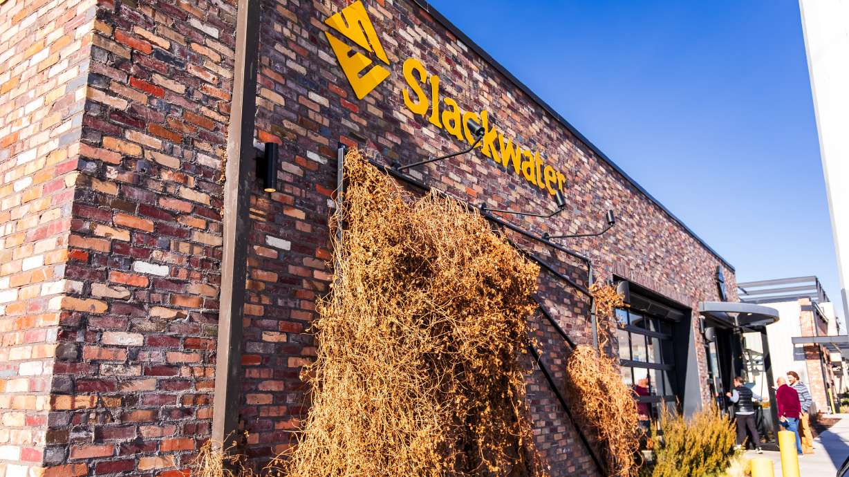 Customers walk into Slackwater Pizzeria in Salt Lake City on Tuesday. The local chain, which has five locations in Utah, was named to Yelp's "Top 100 Restaurants" for 2026.