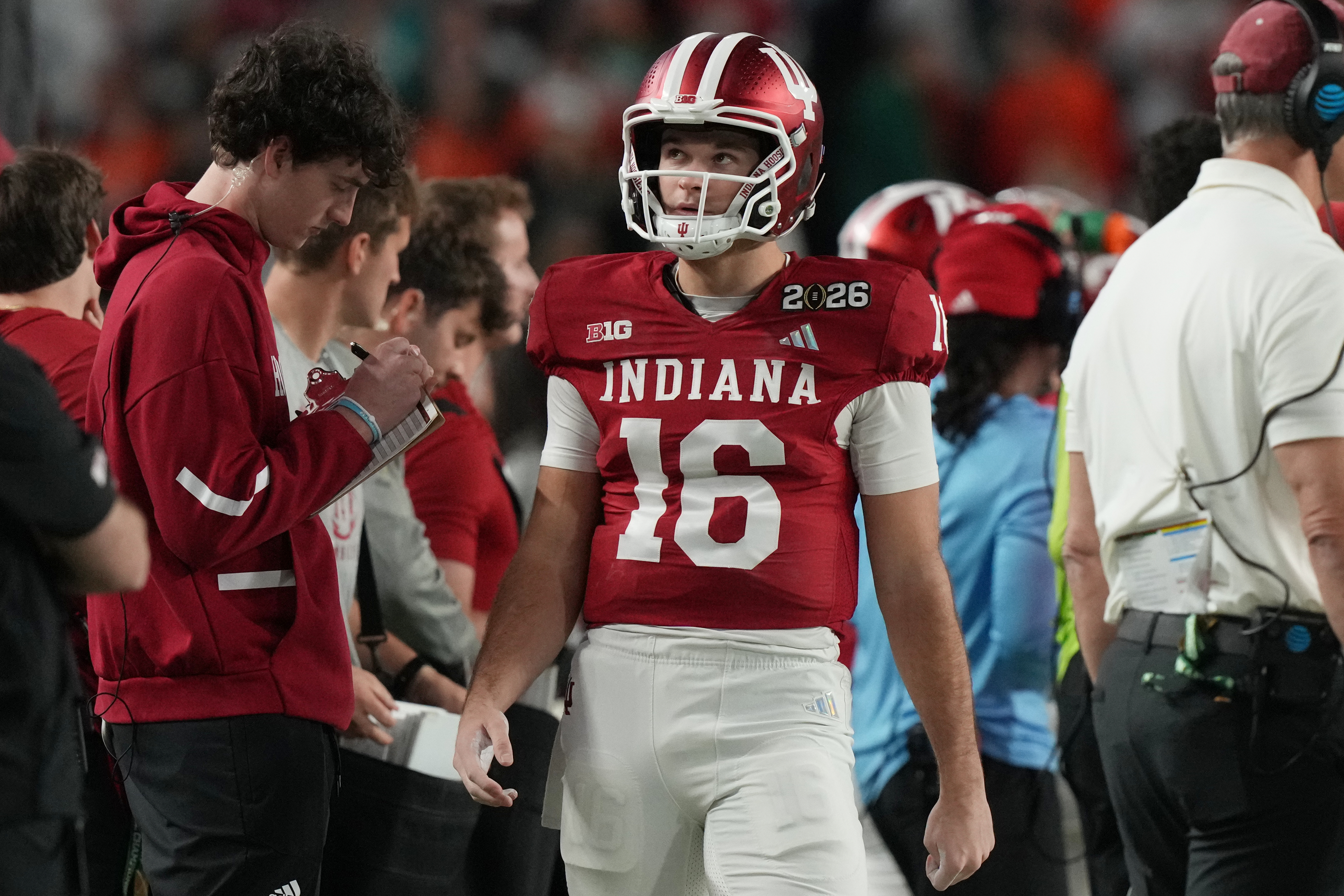 Indiana quarterback Alberto Mendoza (16) walks the sidelines during the College Football Playoff national championship game against Miami, Tuesday, Jan. 20, 2026, in Miami Gardens, Fla. 