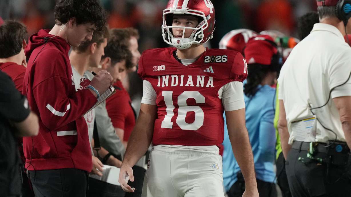 Indiana quarterback Alberto Mendoza (16) walks the sidelines during the College Football Playoff national championship game against Miami, Tuesday, Jan. 20, 2026, in Miami Gardens, Fla.