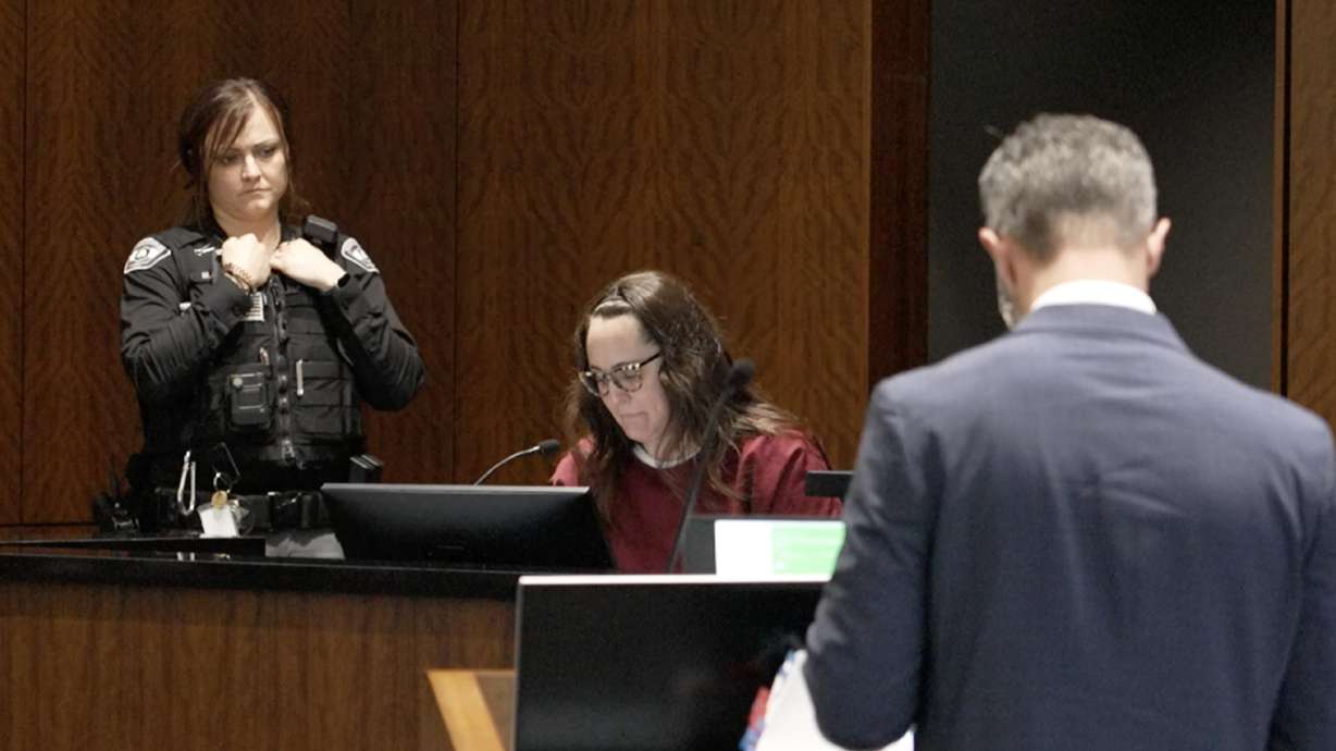 Kathryn Restelli testifies at the jury trial for her brother, Kevin Ellis, on Tuesday. He is accused of conspiring to murder his brother-in-law.