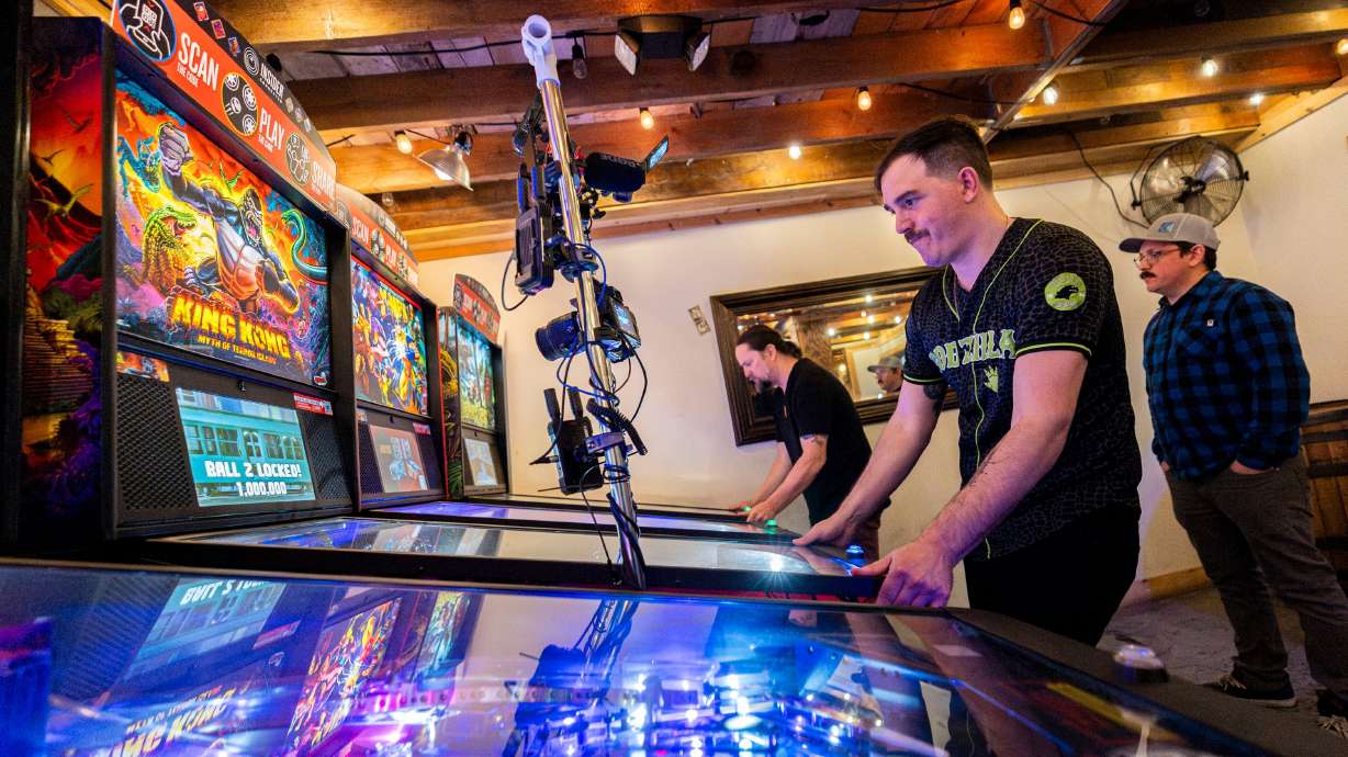 Cade Vincent, of Ogden, plays a pinball machine during the 2025 IFPA Utah State Pinball Championship held at Kiitos Brewing in Salt Lake City on Saturday. The championships, which included both an open championship and a women's championship, were held Jan. 17 and 18 in Salt Lake City and South Jordan.