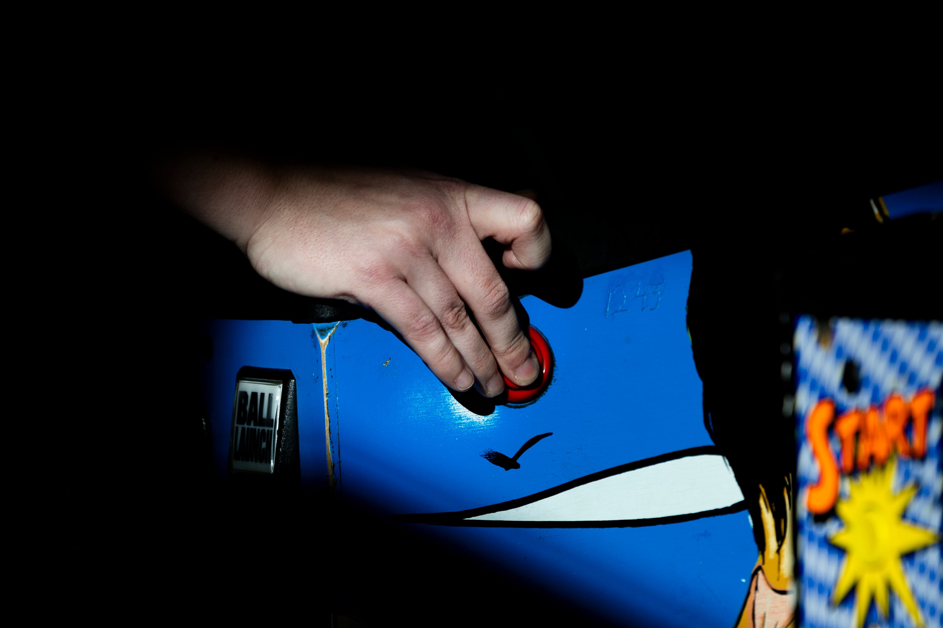 Paige Peck plays a game on the “Baywatch” pinball machine during the championship match of the 2025 IFPA Women’s Pinball State Finals at the Holiday Inn in South Jordan on Sunday.