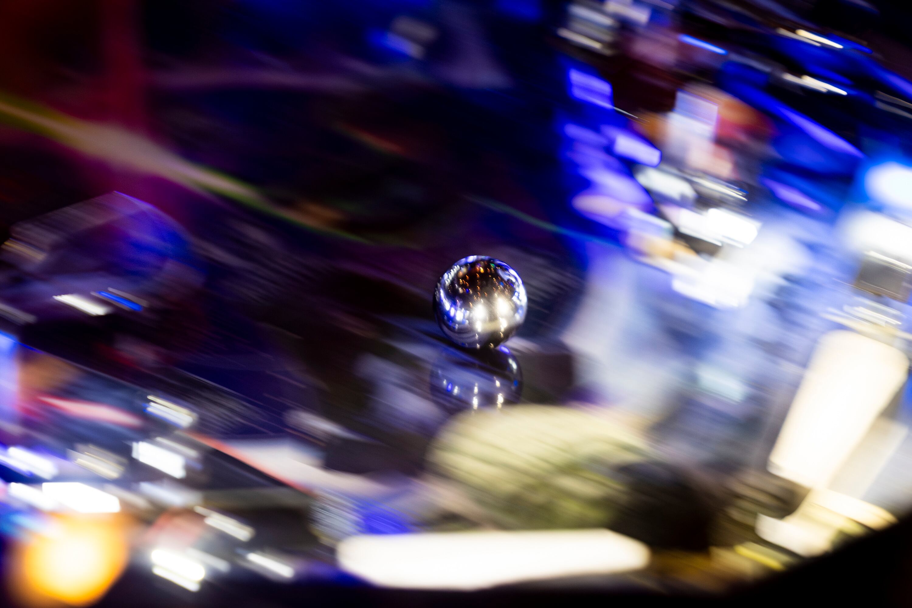 A ball bounces around a pinball machine as a player competes during the 2025 IFPA Utah State Pinball Championship held at Kiitos Brewing in Salt Lake City on Saturday.