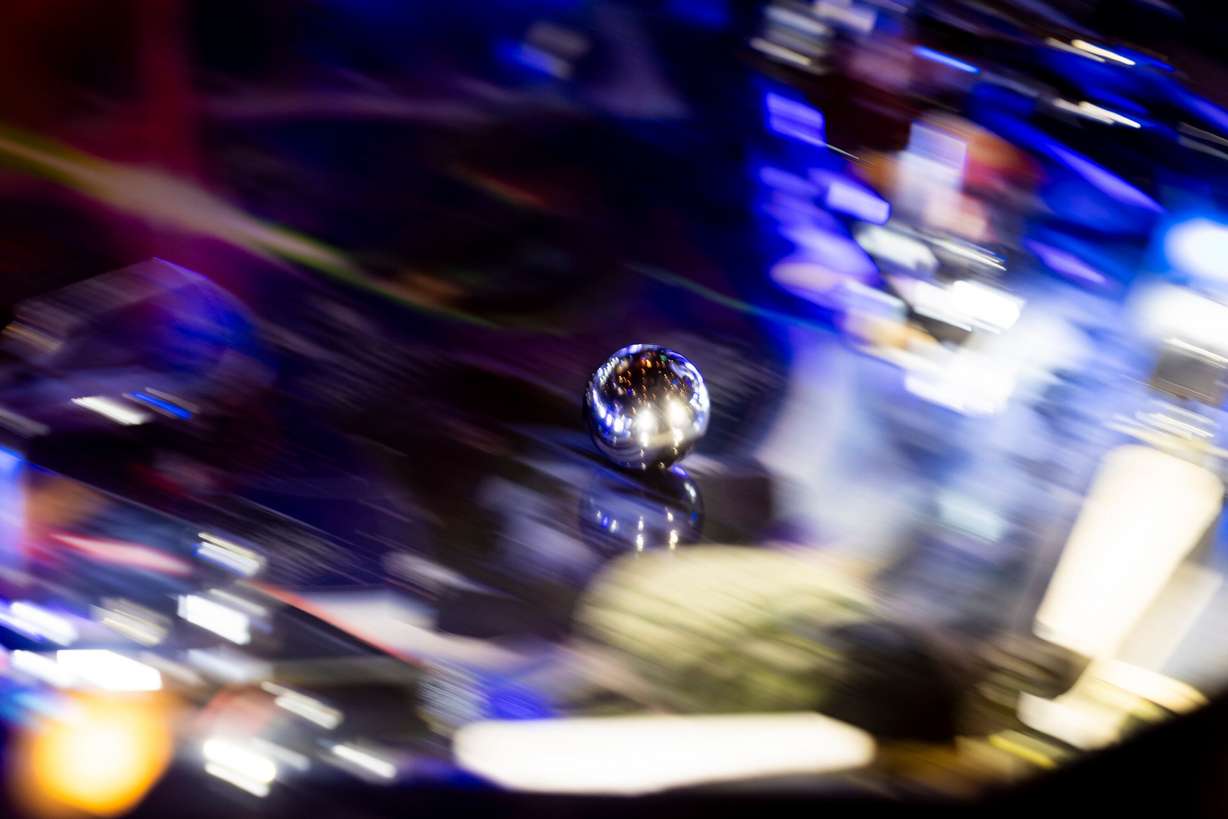 A ball bounces around a pinball machine as a player competes during the 2025 IFPA Utah State Pinball Championship held at Kiitos Brewing in Salt Lake City on Saturday.