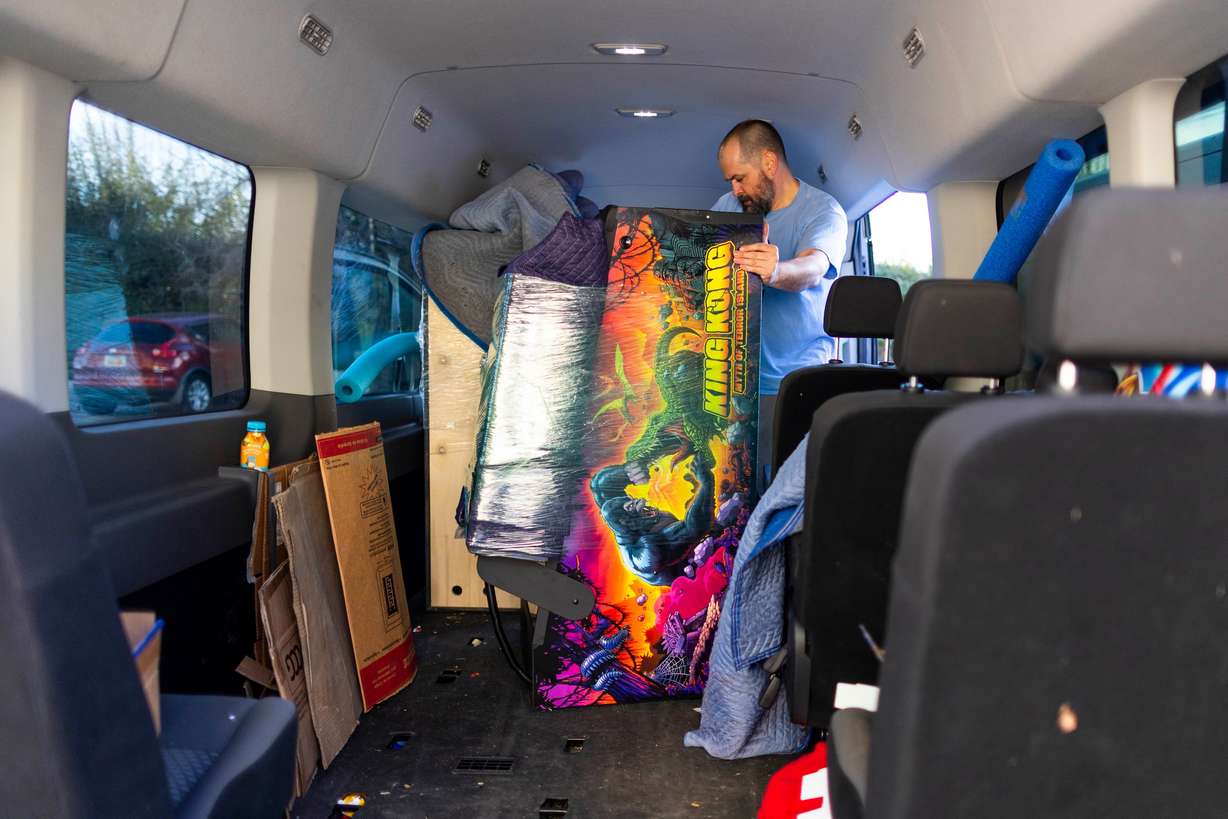 Owner of The L.A.B. in Ogden Nate Smith loads pinball machines into his van to get transported back to The L.A.B. after the 2025 IFPA Women’s Pinball State Finals at the Holiday Inn in South Jordan on Sunday.
