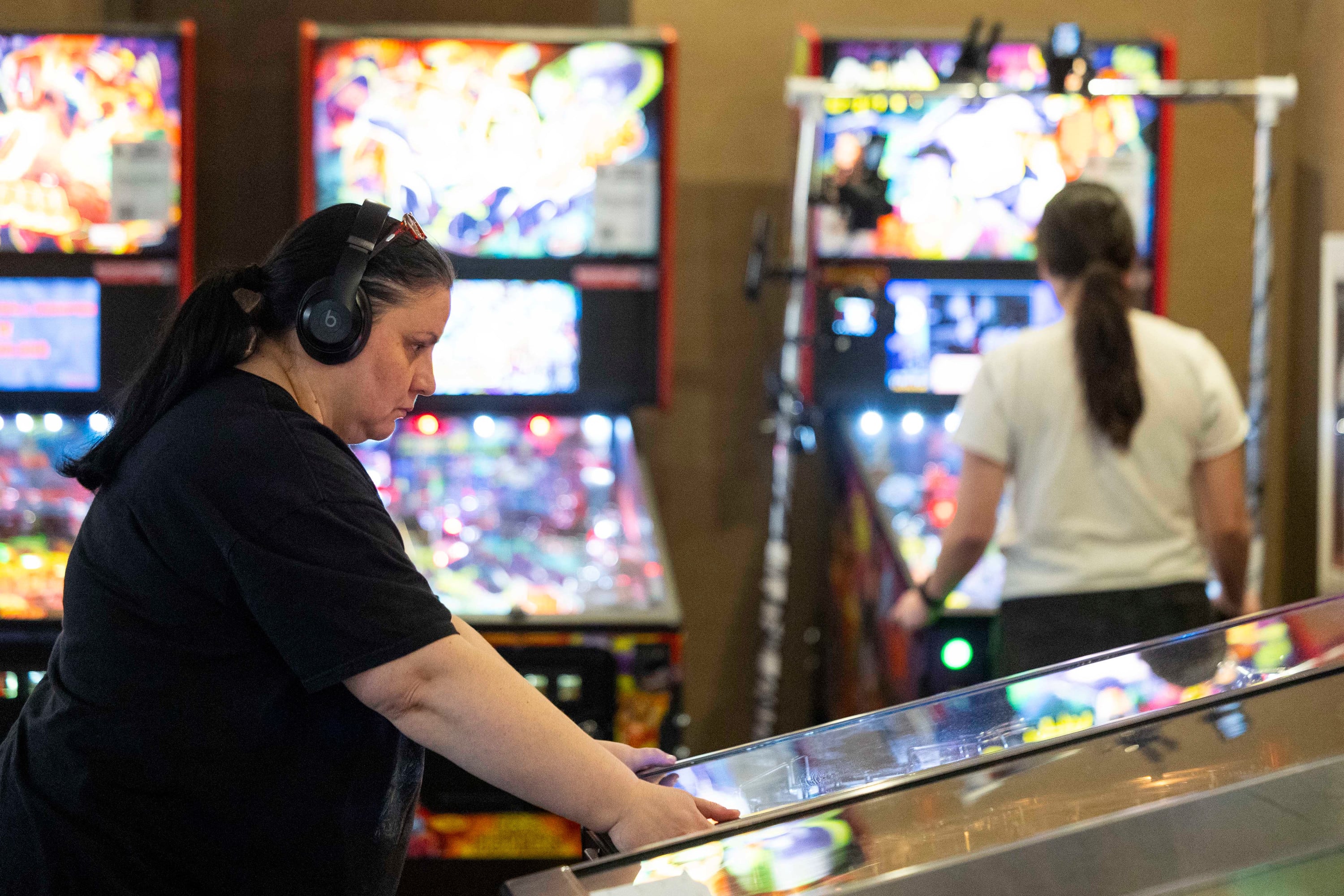 Rose Milovanovic-Medina, of Ogden, competes in the third place match during the 2025 IFPA Women’s Pinball State Finals at the Holiday Inn in South Jordan on Sunday.
