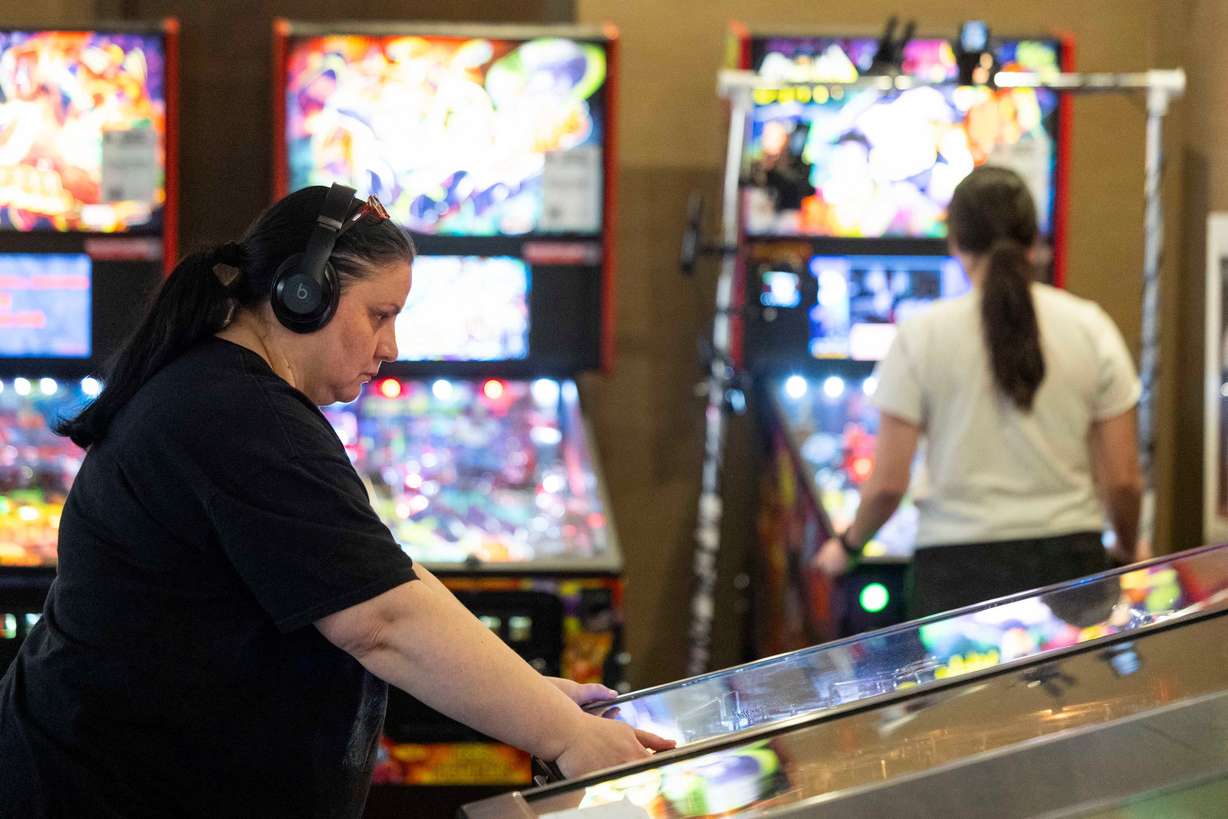 Rose Milovanovic-Medina, of Ogden, competes in the third place match during the 2025 IFPA Women’s Pinball State Finals at the Holiday Inn in South Jordan on Sunday.