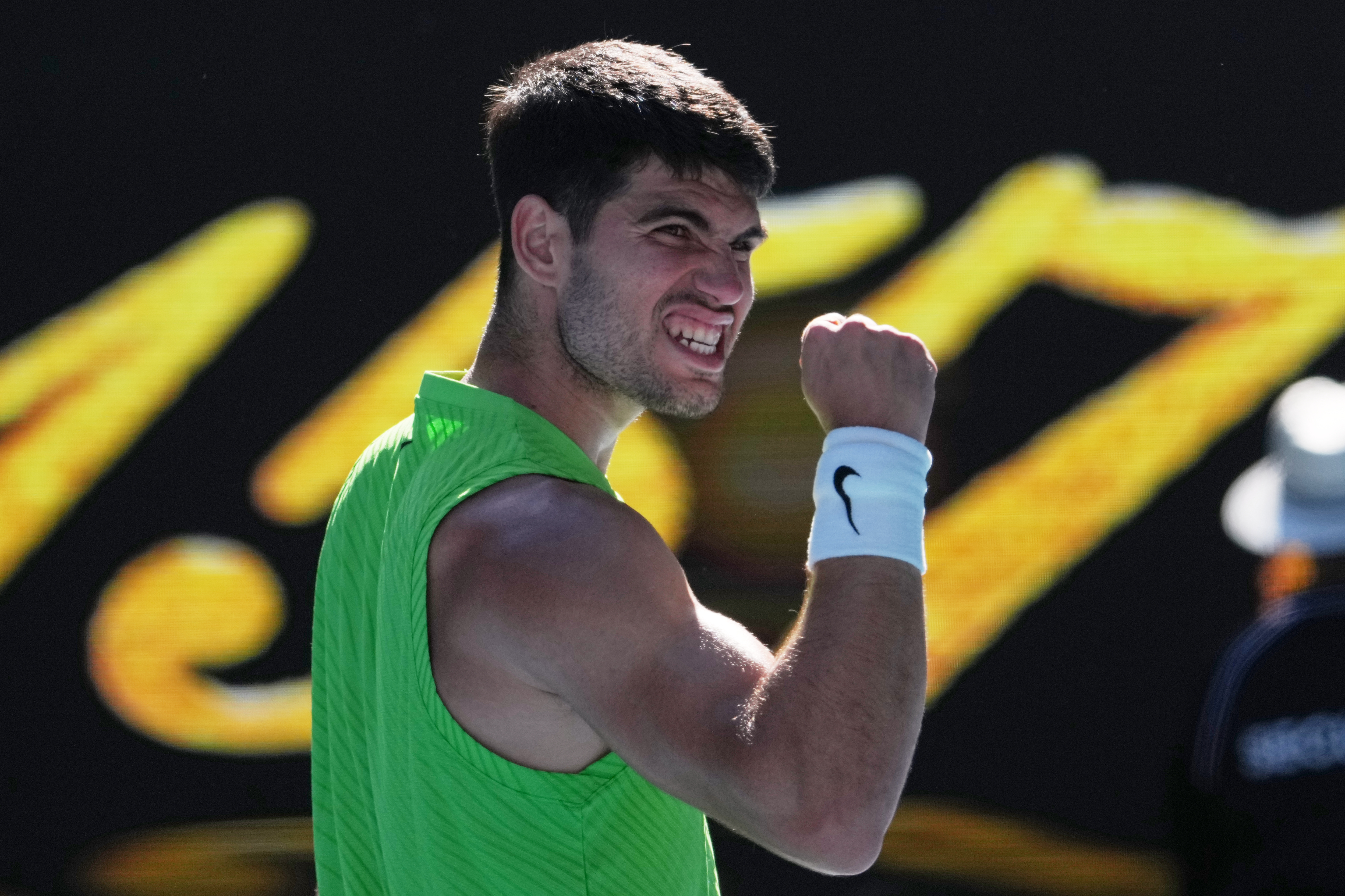 Carlos Alcaraz of Spain celebrates after defeating Yannick Hanfmann of Germany in their second round match at the Australian Open tennis championship in Melbourne, Australia, Wednesday, Jan. 21, 2026. 