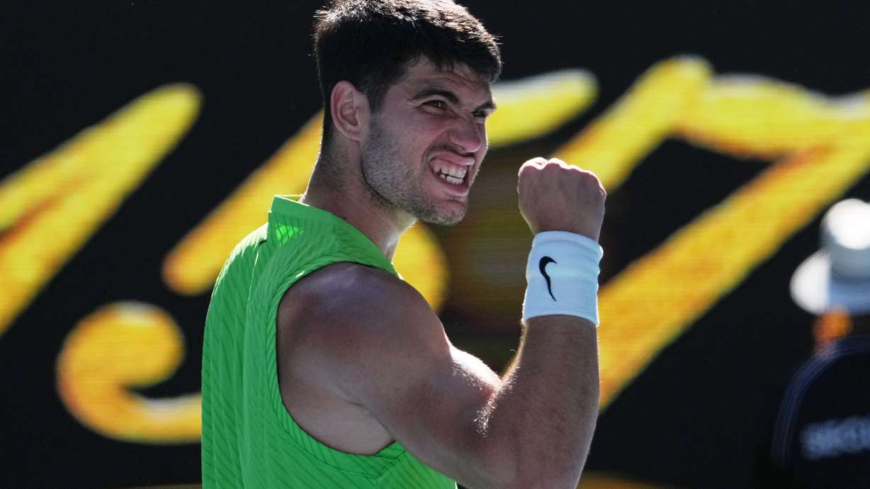 Carlos Alcaraz of Spain celebrates after defeating Yannick Hanfmann of Germany in their second round match at the Australian Open tennis championship in Melbourne, Australia, Wednesday, Jan. 21, 2026.
