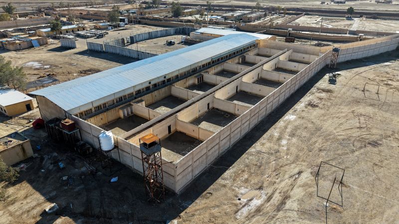 A drone view of al-Shaddadi prison following the withdrawal of the Syrian Democratic Forces and its takeover by the Syrian army, as inmates, members of Islamic State, fled the facility, in al-Shaddadi, Syria, Tuesday. 