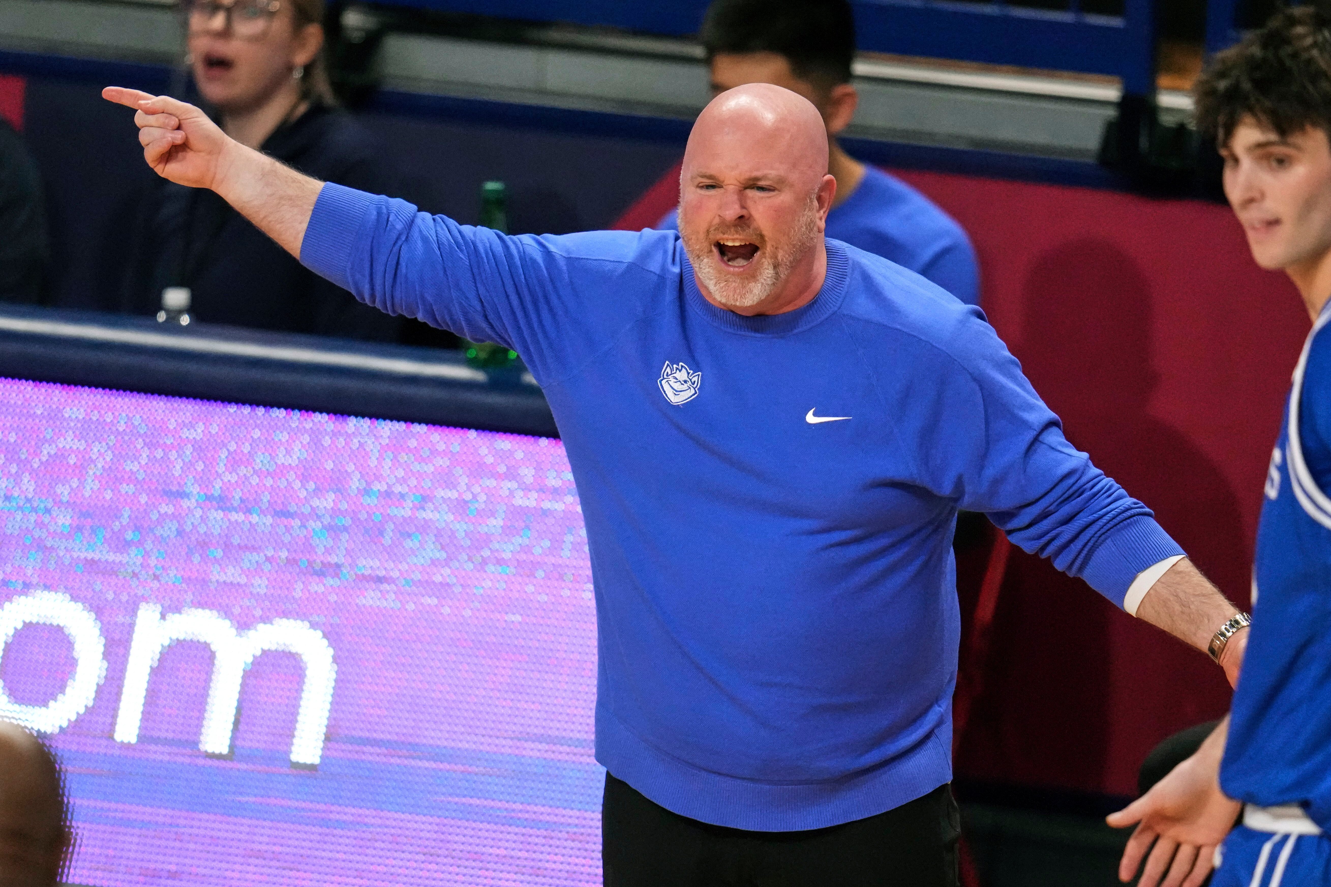 Saint Louis head coach Josh Schertz gives instructions during the first half of the team's NCAA college basketball game against Duquesne in Pittsburgh, Tuesday, Jan. 20, 2026. 