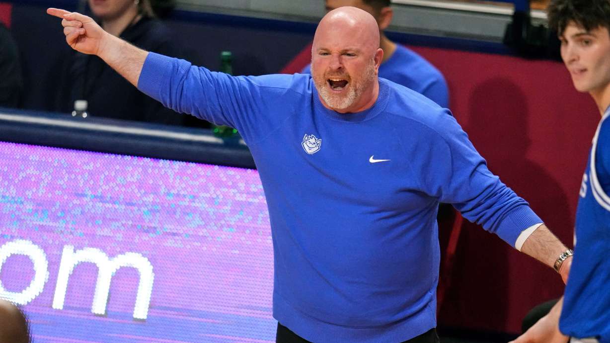 Saint Louis head coach Josh Schertz gives instructions during the first half of the team's NCAA college basketball game against Duquesne in Pittsburgh, Tuesday, Jan. 20, 2026.
