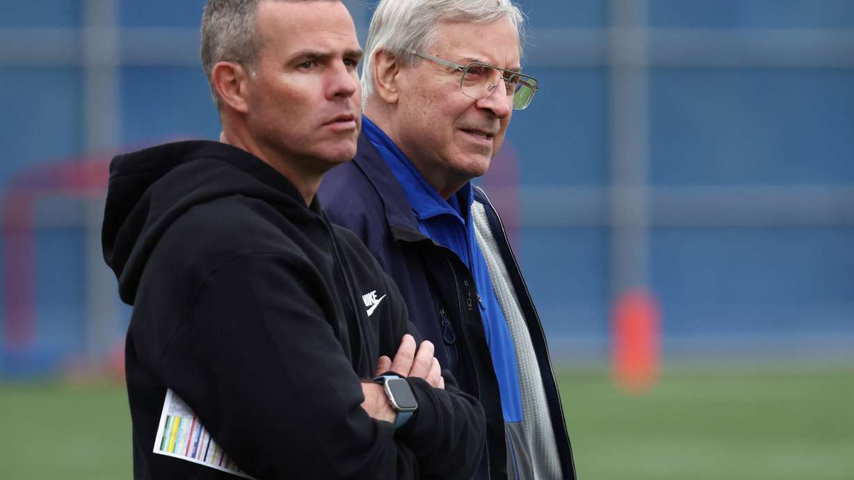 FILE - Buffalo Bills general manager Brandon Beane,Left and owner Terry Pegula look on during NFL football practice in Orchard Park, N.Y., Tuesday, June 11, 2024.